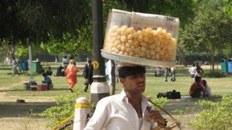 Man carrying food India_by martin Roos