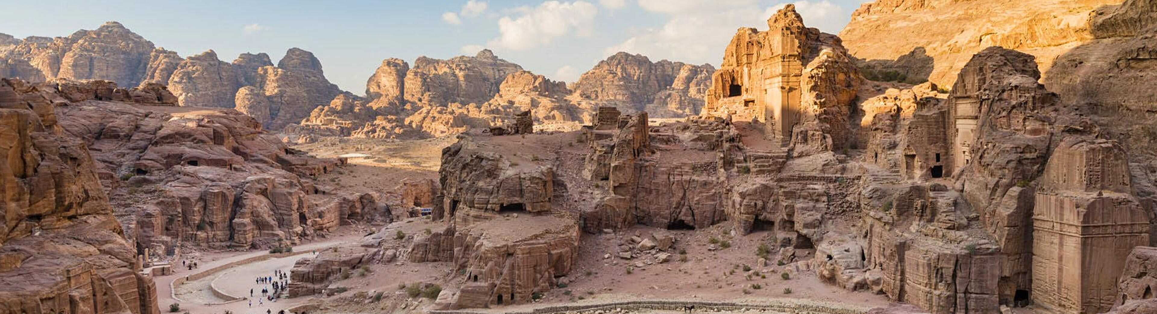 Carved stone facade of a historic building in Petra, Jordan.