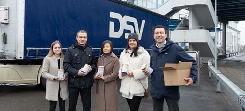 Employees from DSV and Hochdorf in front of DSV truck