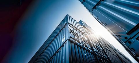 Picture of stacked blue containers rising high