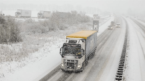Truck driving in snow