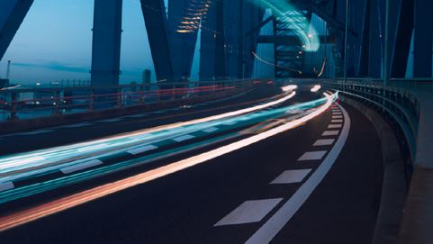 Road over bridge showing car lights