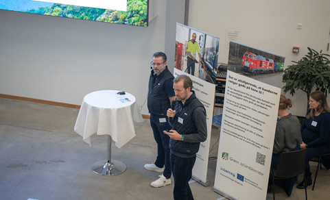 Two men speaking about sustainability