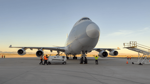 Air cargo charter plane being loaded with goods