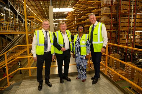 Deputy Director General for SA Department of Trade Industry Lerato Mataboge, Minister of Foreign Affairs Lars Løkke Rasmussen, DSV Group COO Brian Ejsing, and DSV SA Managing Director for Solutions - Healthcare Anthony Diack standing side by side inside the DSV Gauteng Warehouse Logistic Centre located in South Africa. 