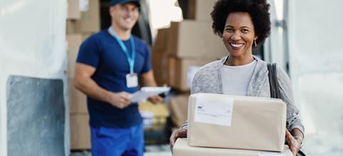 Black female holding a parcel that a DSV driver delivered