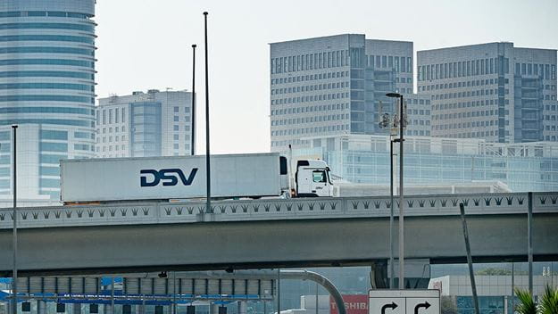 A DSV truck is driving on the bridge