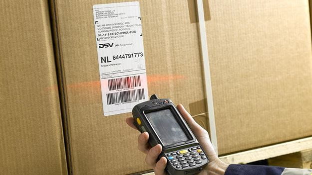 Scanning a barcode on cargo in the Kuwait warehouse