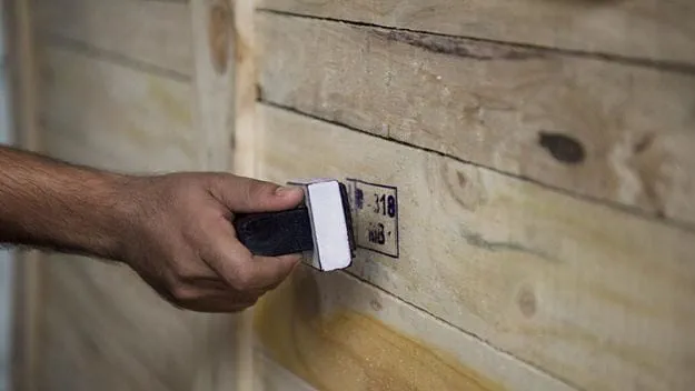 Stamp with black ink on wood