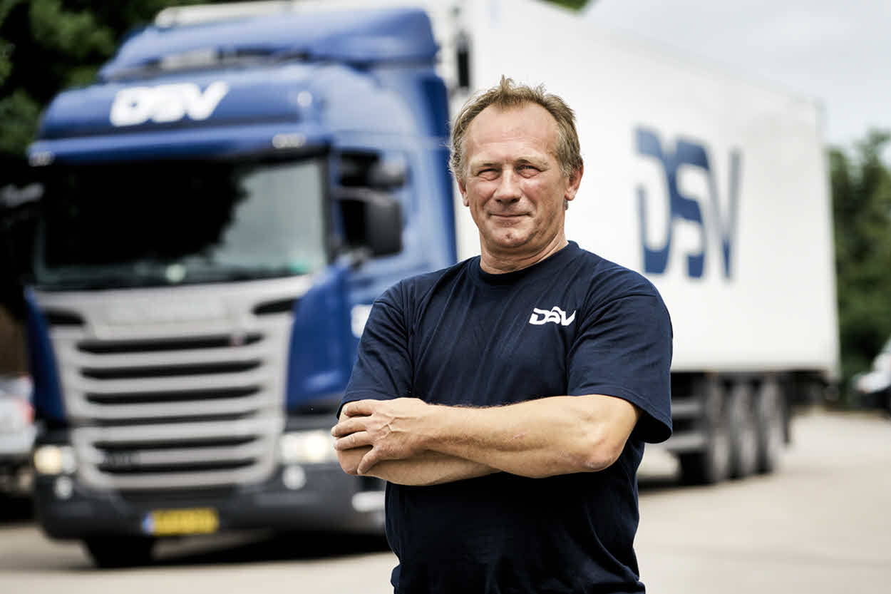 Haulier standing in front of his truck