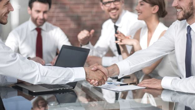 Employees at DSV shaking hands