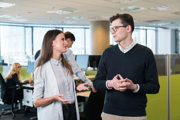 Two employees at DSV working and talking