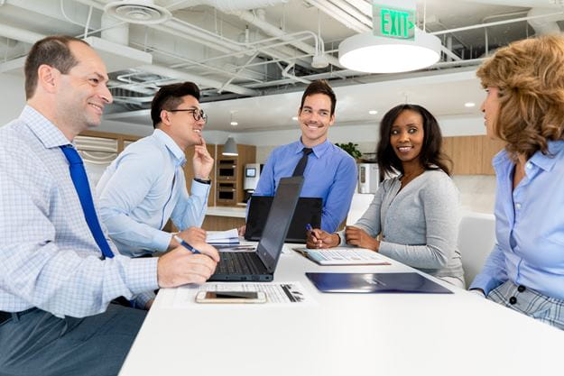 Employees at DSV working and collaborating 