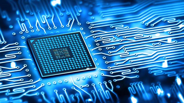 Close-up of a microchip on a circuit board with glowing blue lines.