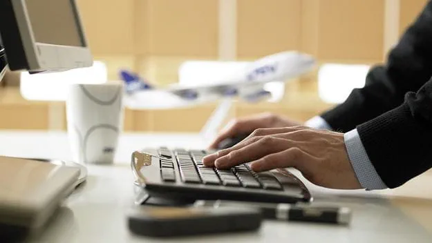 DSV office worker using technology for logistics.