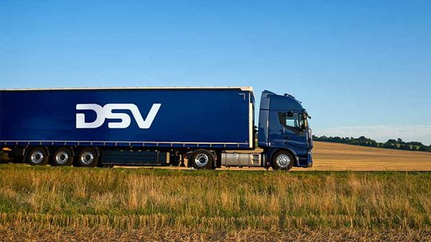 DSV truck driving through open countryside, highlighting efficient road transport across rural landscapes