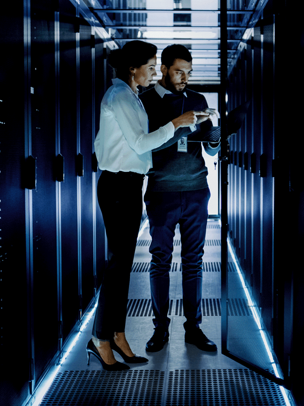 colleagues inspecting a server