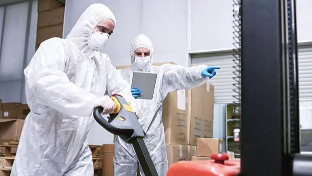 Healthcare personnel wearing masks and safety suit
