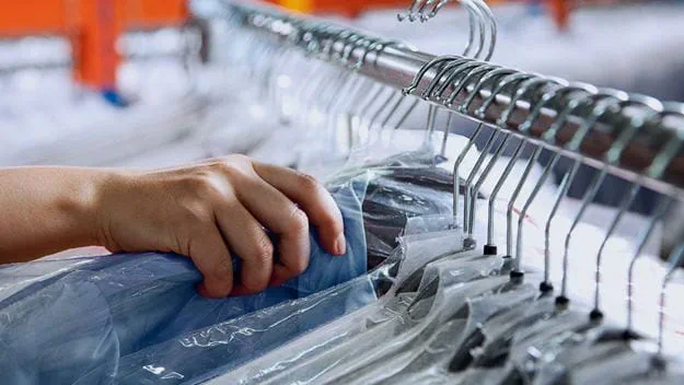 Hand picking clothes in a warehouse