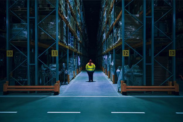 DSV employee walking in warehouse