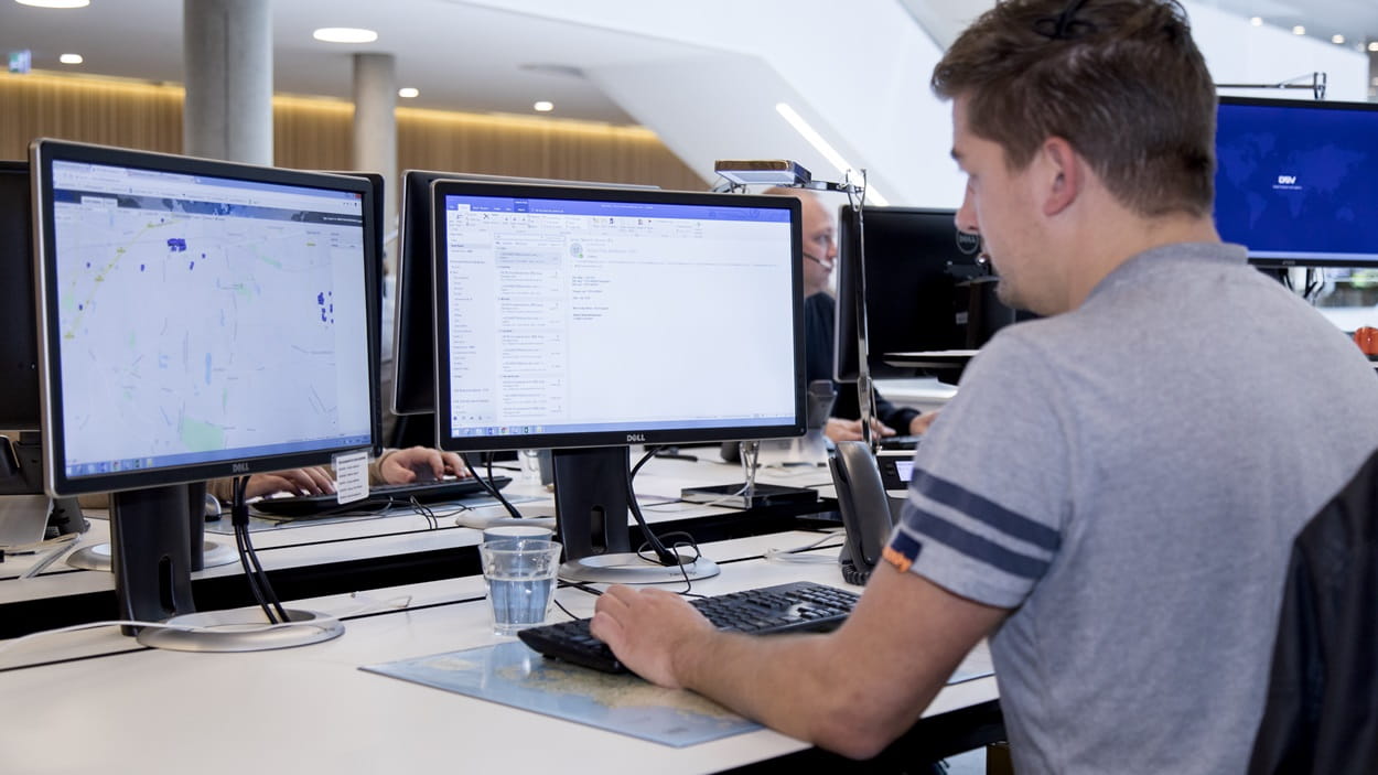 Male managing freight for contract logistics