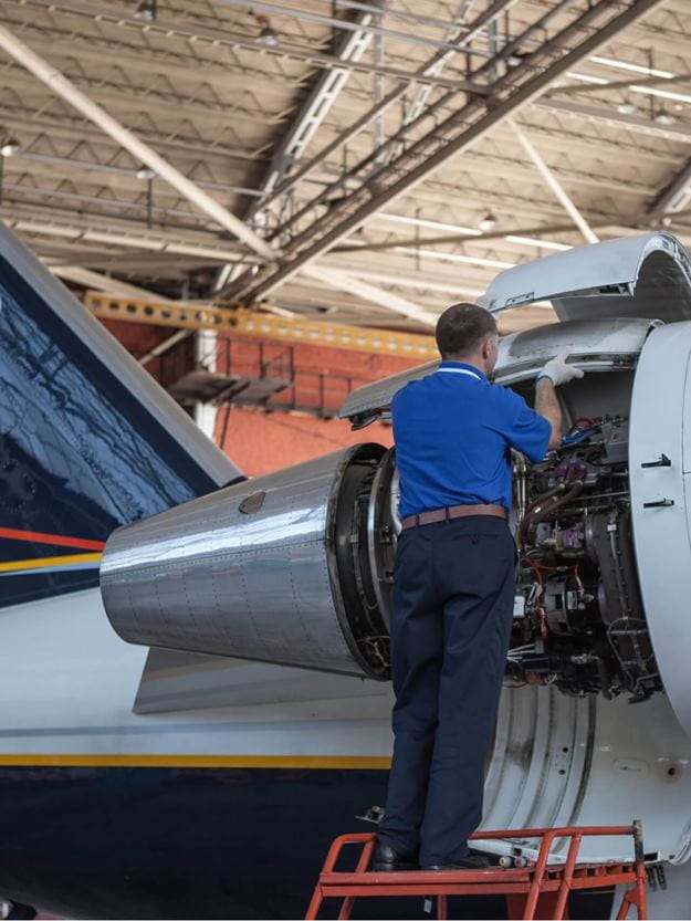 Engineer installing parts into an airplane that was just shipped