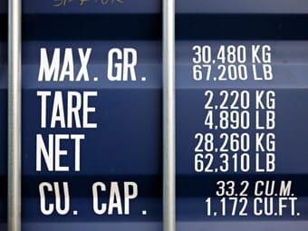 Weight and dimensions information displayed on a container.